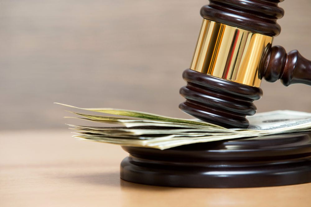 Law gavel on a stack of American money