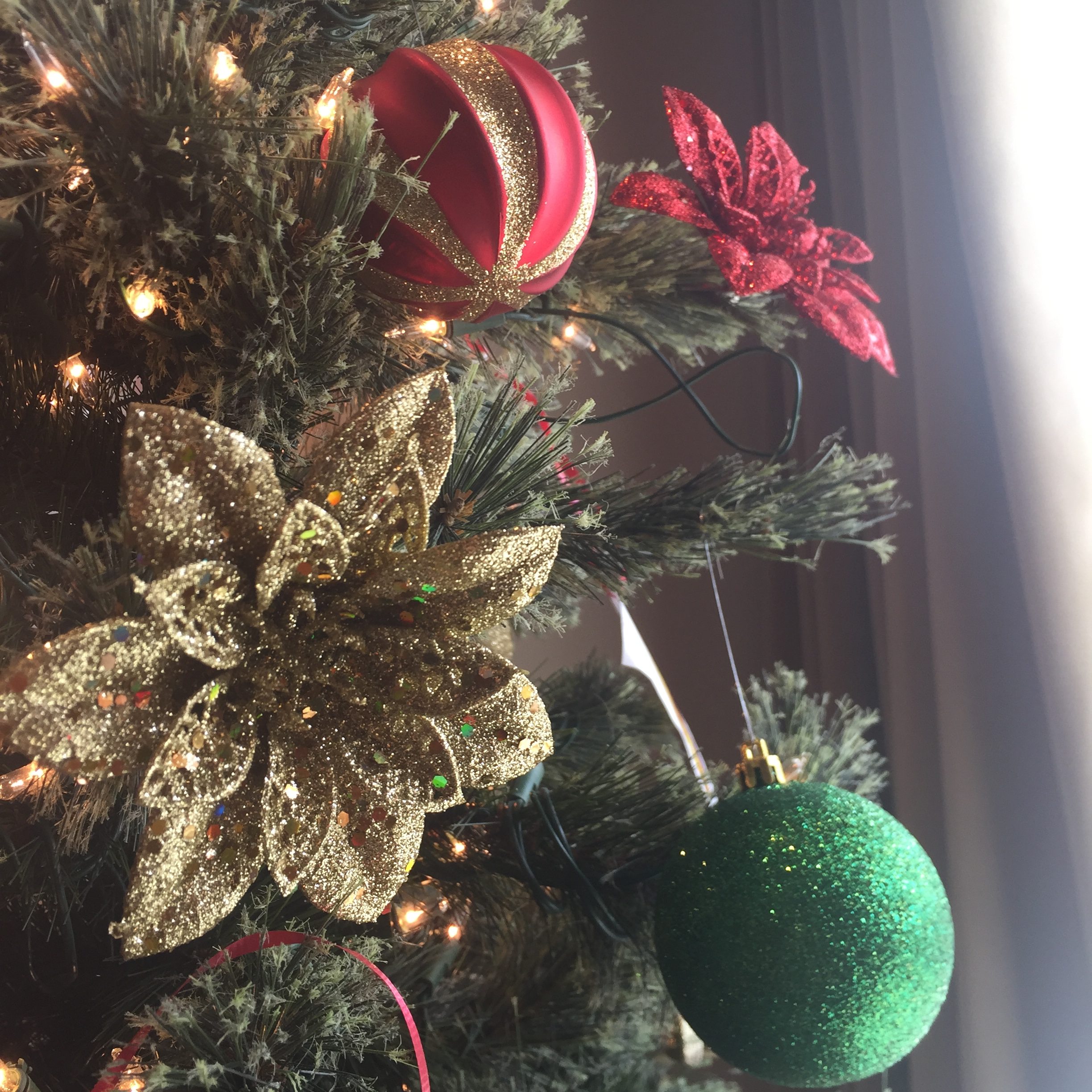 closeup of christmas ornaments on a tree