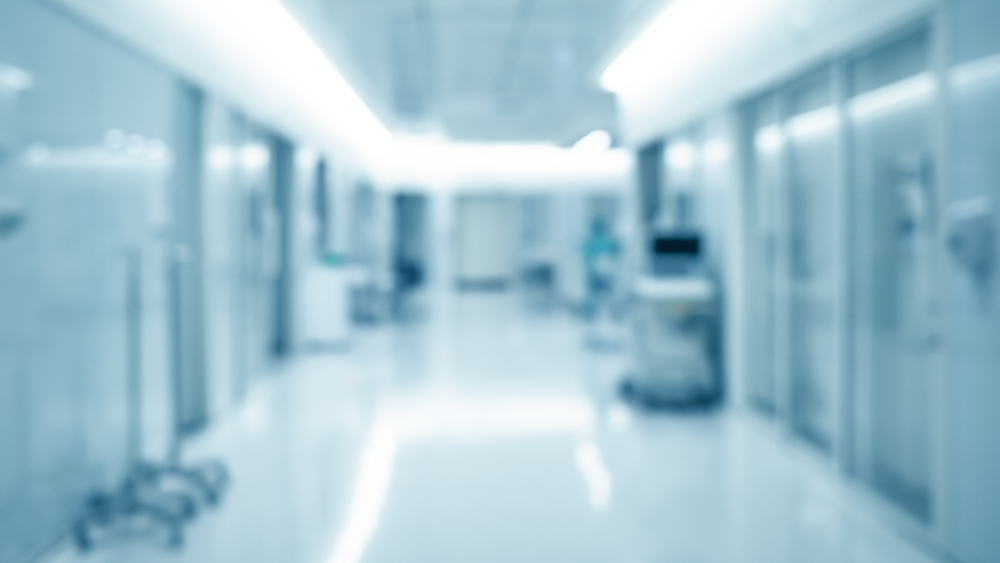 blurred view of a hospital icu burn unit hallway