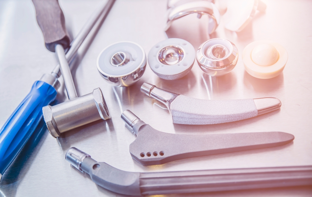 closeup view of total hip replacement parts on a metal table