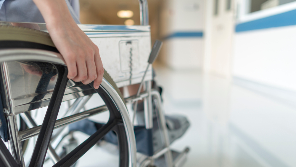 Close up of a paralysis injured female in wheel chair