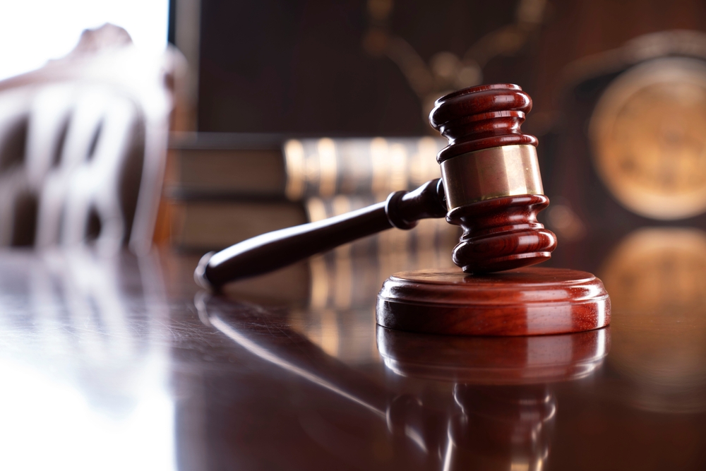 wooden gavel on a wooden desk