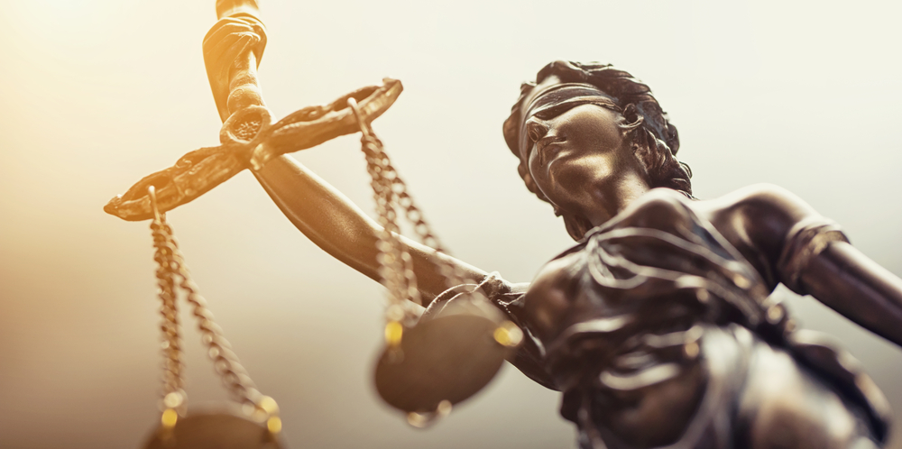 closeup view of statue of lady justice holding scales