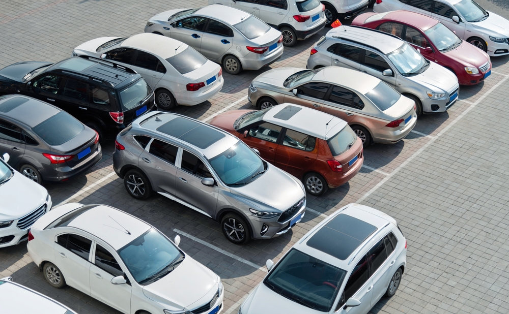 Parking lot filled with cars view from above